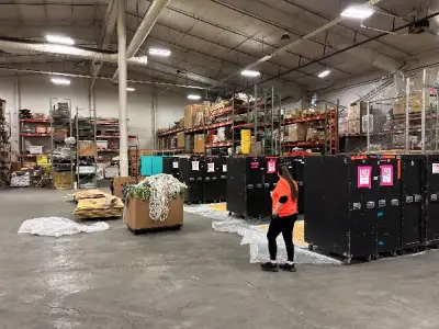 Warehouse prep for building/breaking down pallets for air cargo transport of Mean Girls.